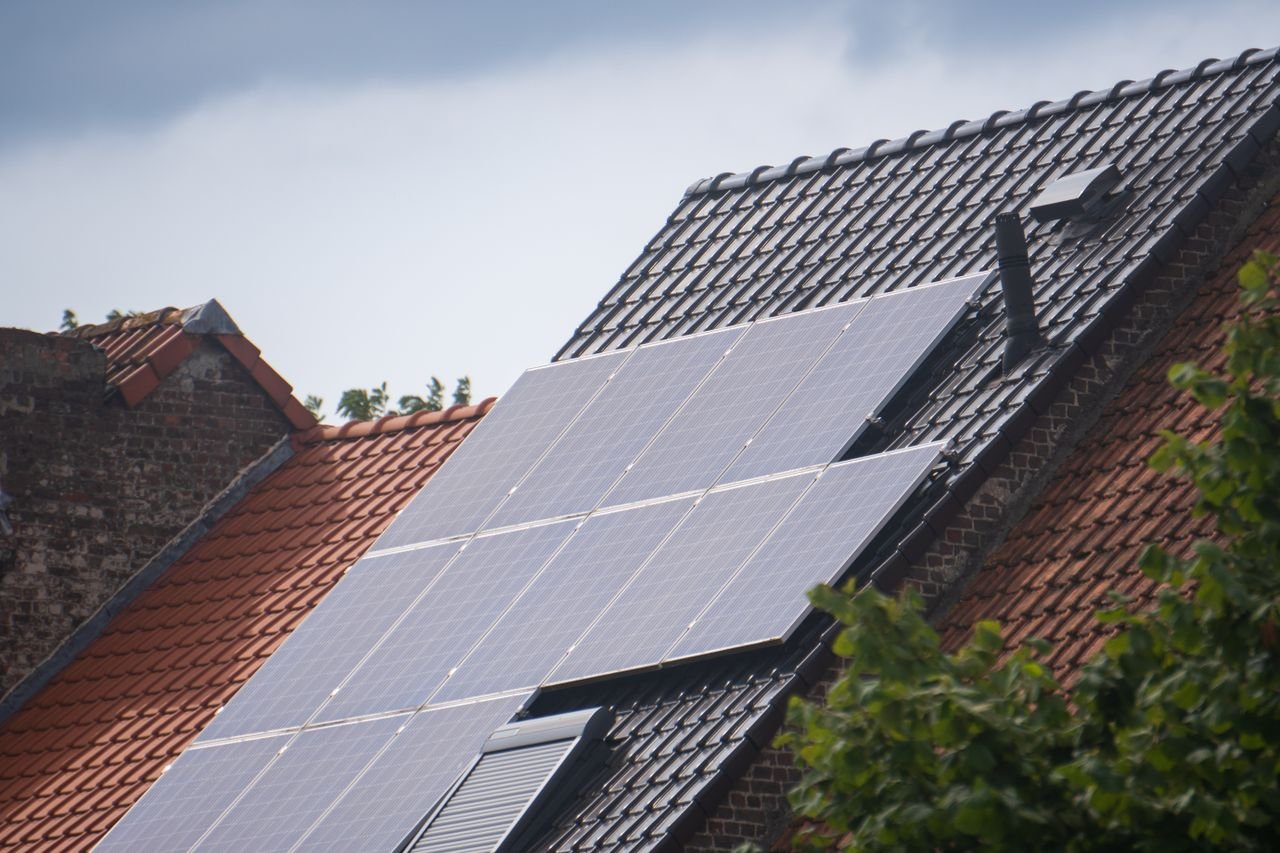 Home Solar panels installed on a residential rooftop, showcasing eco-friendly renewable energy solutions.